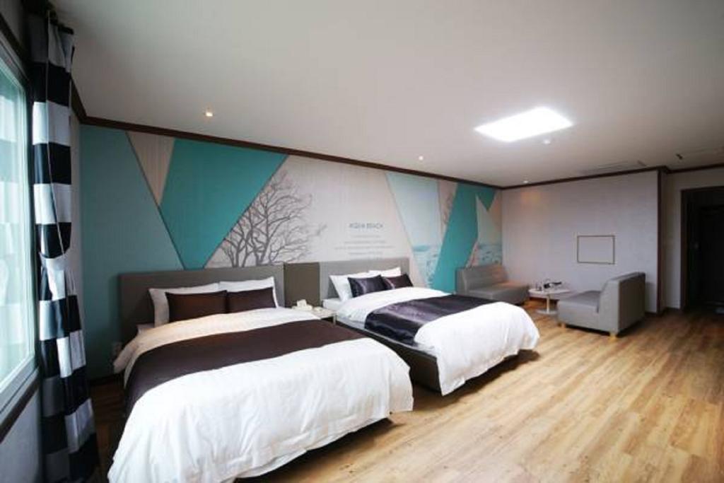 Seongsan Aqua Beach Hotel Согвипхо Номер фото