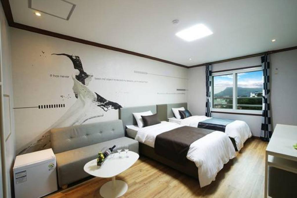 Seongsan Aqua Beach Hotel Согвипхо Номер фото